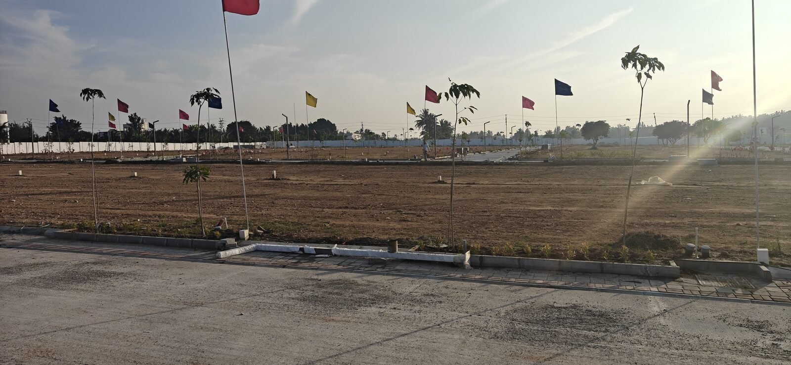 Vistara Green City - Open residential plots at sunset